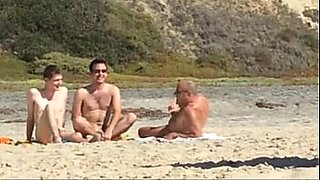 and son together nude in sea beach