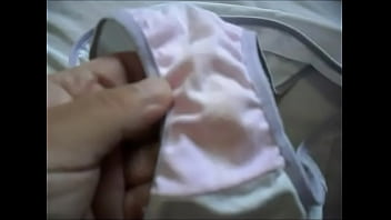 angela teases in pink silky corset and satin panties