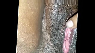 girl fingers her shaved pussy