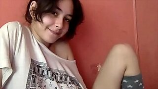 kinky teen rubs her wet panties on her cunt in bed