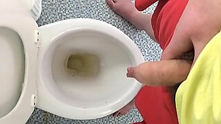 pissing male in toilet